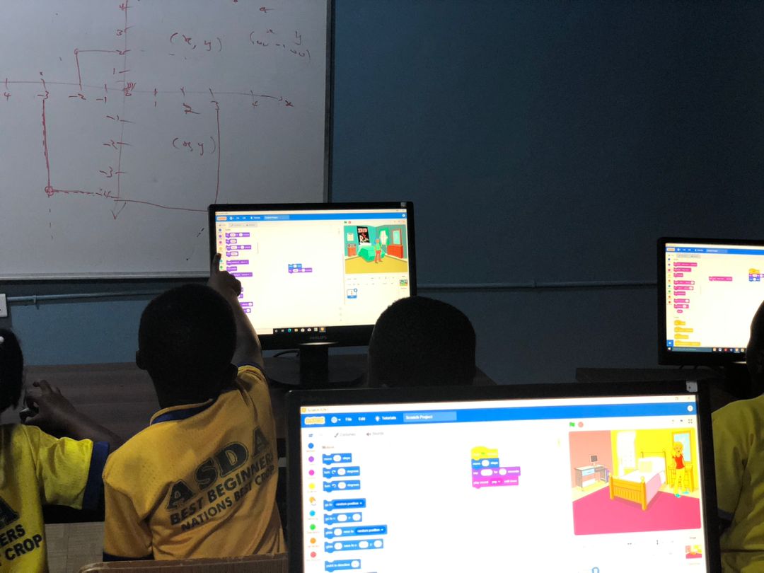 Students learning Scratch coding during a STEM session