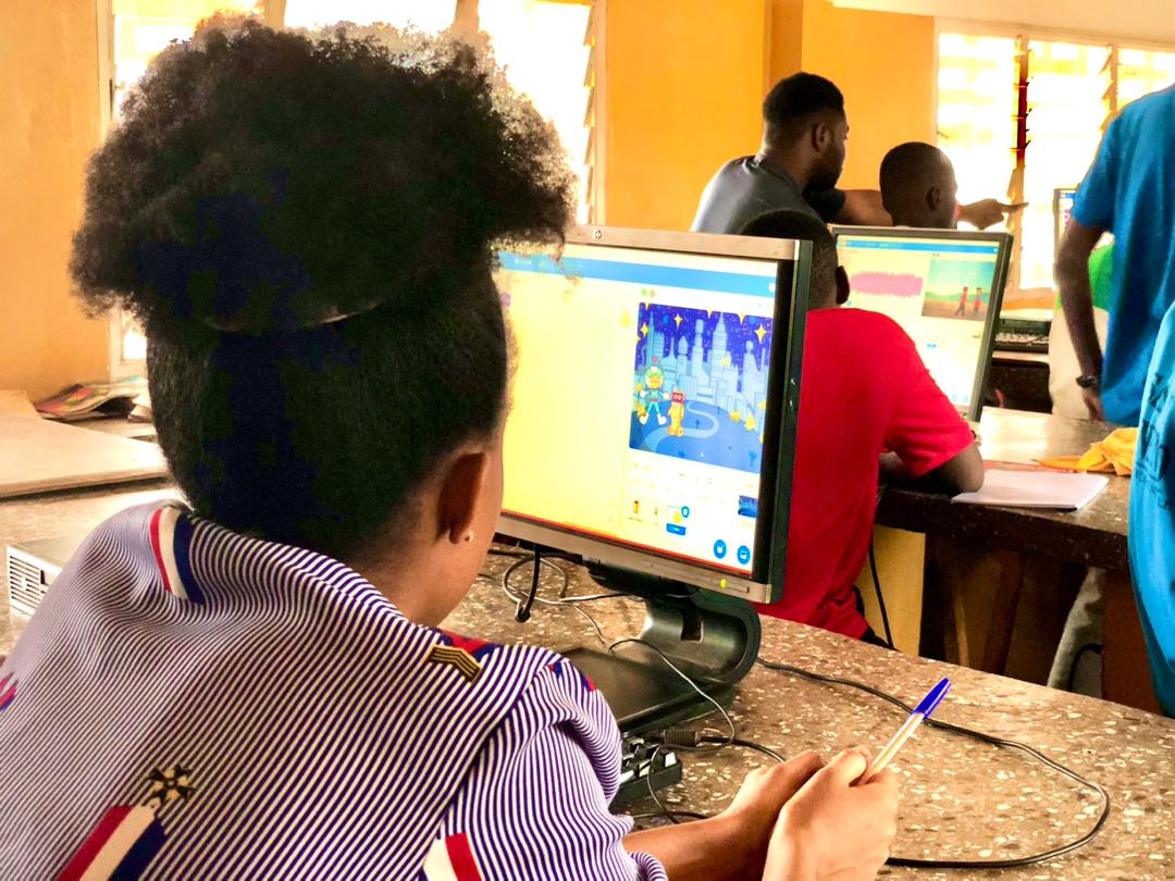 Young learner designing an animated game in Scratch