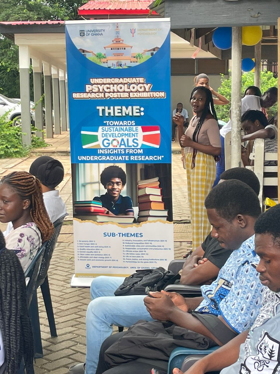 Students presenting research at the SDG poster exhibition