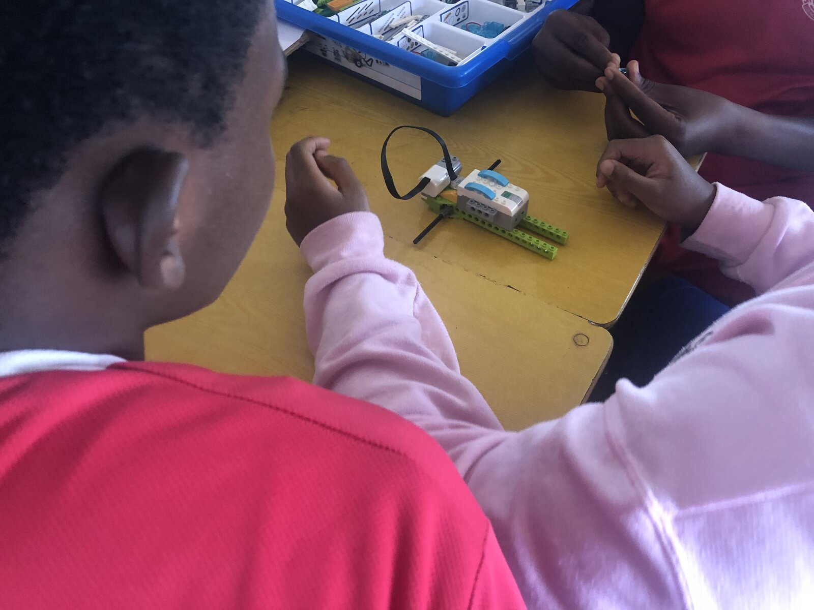 Young learners building a LEGO WeDo robot
